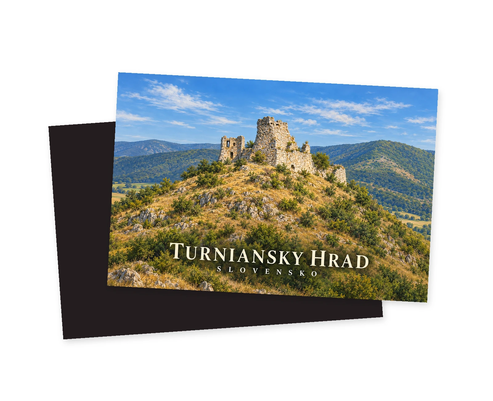 Náhľad magnetky Turniansky hrad, na prednej strane zrúcanina na skalnatom svahu a zelené kopce; za ňou je posunutá tmavá zadná strana na bielom pozadí.